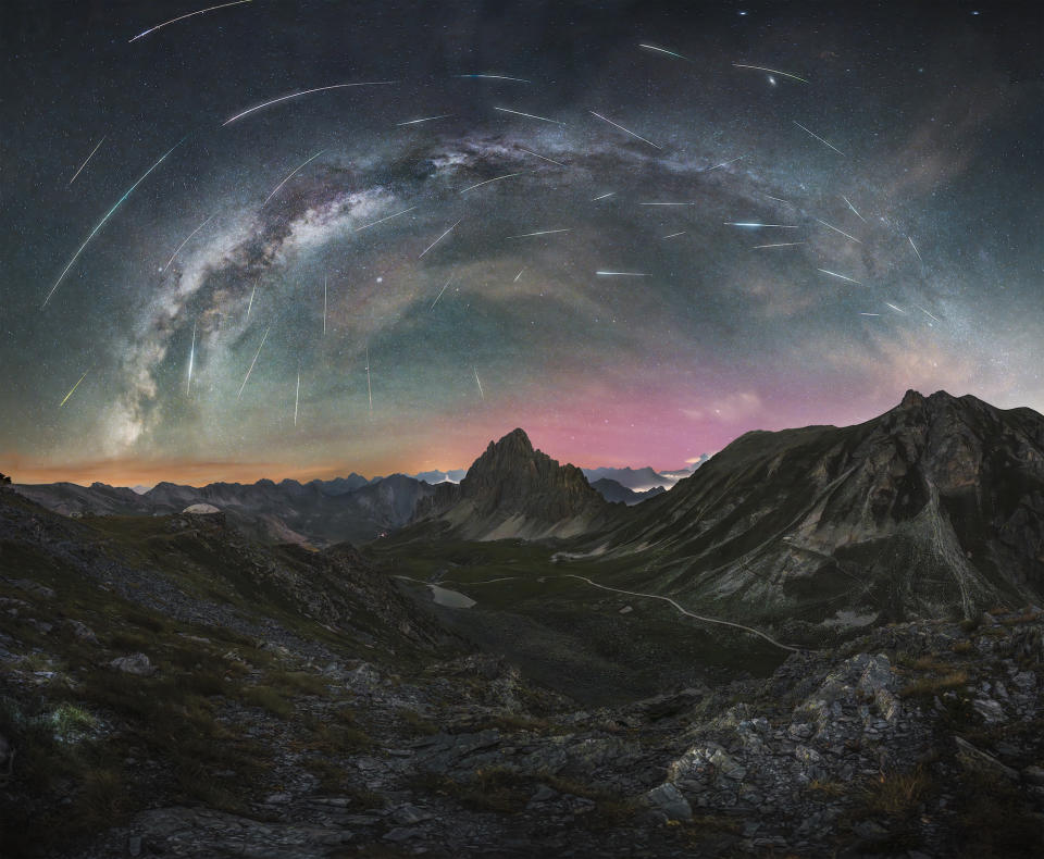 Northern lights, meteor showers and the Milky Way move across the sky over a mountain range