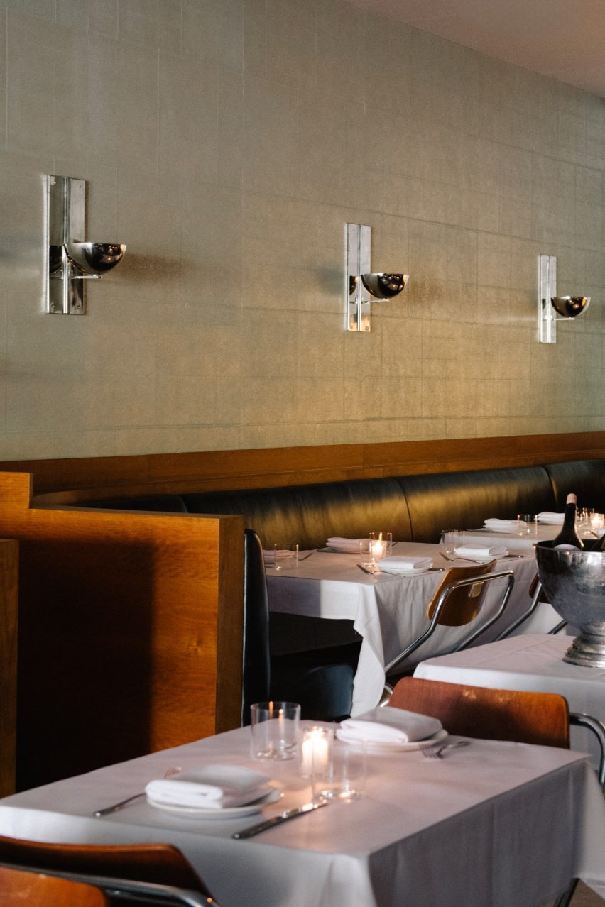 Cherry wood and black leather bench seating in the restaurant