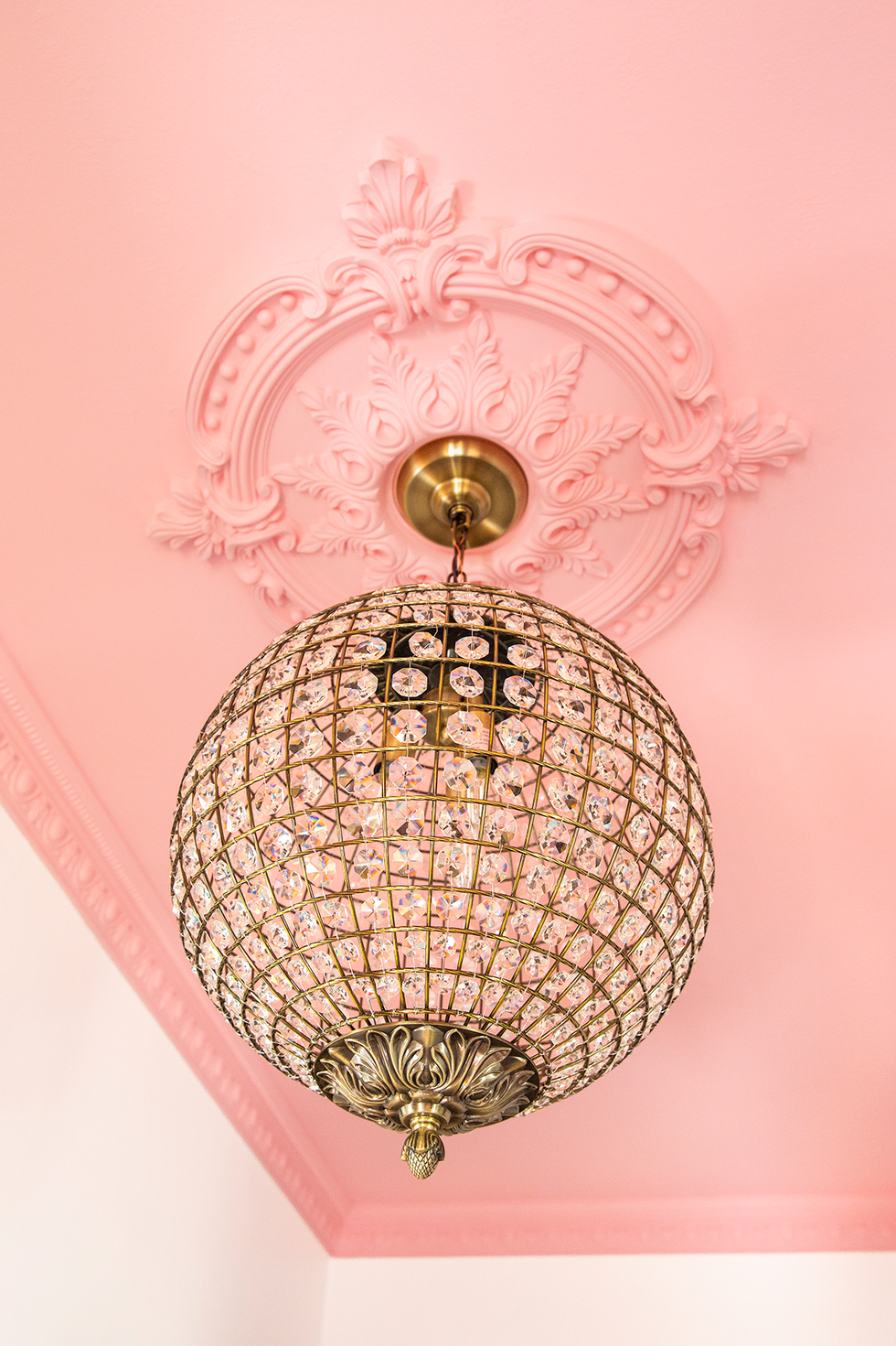 pink ceiling with chandelier