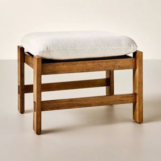 Ottoman with wooden frame and attached cushion