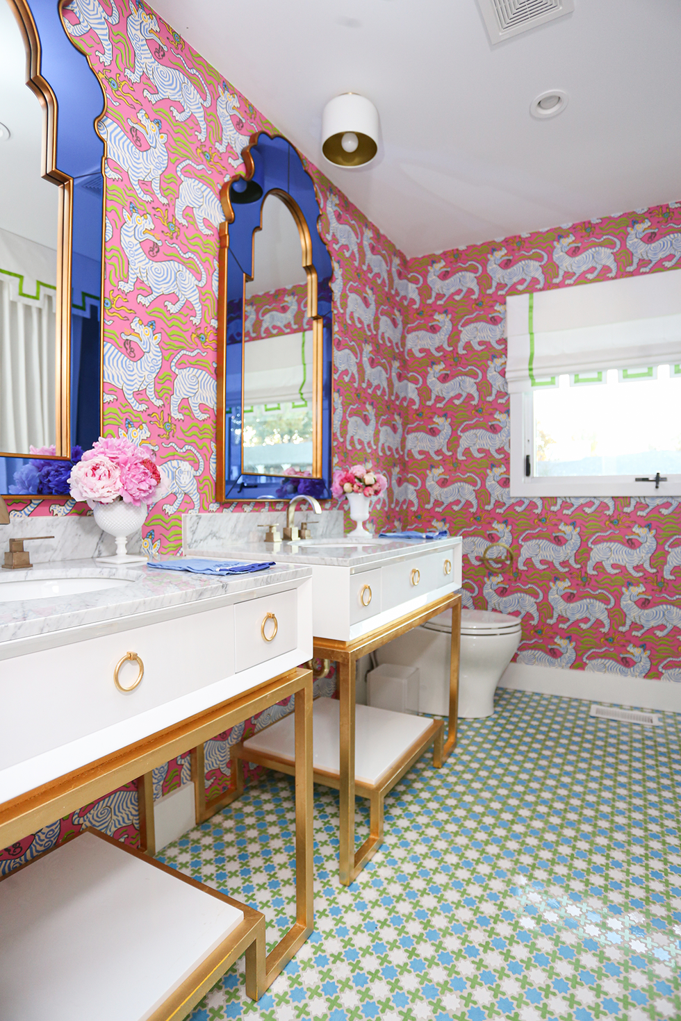 Colorful bathroom with tiles and wallpaper