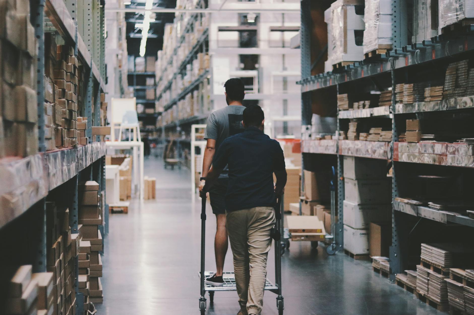 Men go around a warehouse