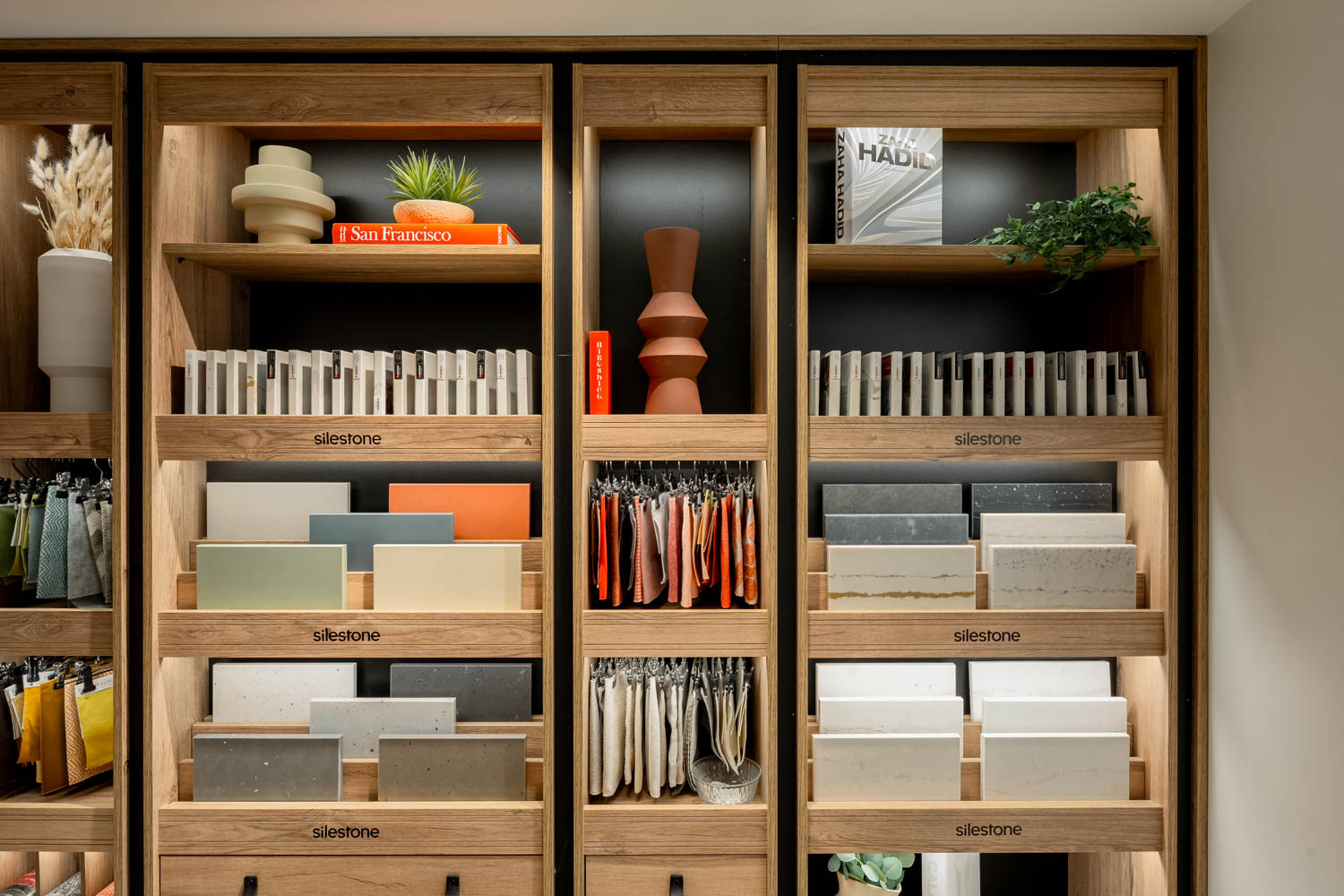 Library with wooden shelves full of materials and patterns