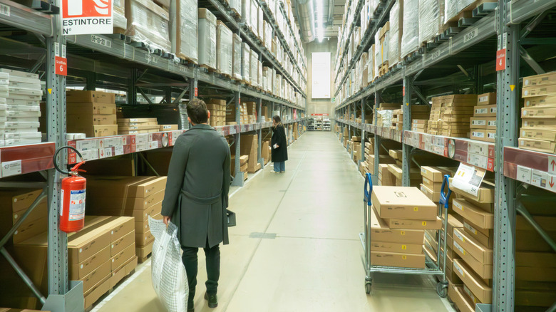 Customers shop in an IKEA warehouse