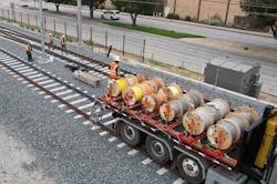 Crews installing miles of underground cables for the train control system.