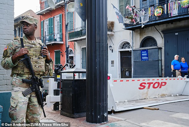 A member of the Louisiana National Guard Patrols outside of a blocked section of the Bourbon Street as part of the security measures for Super Bowl Lix