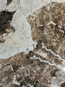 As seen at large-format porcelain slab manufacturer Venux, even up close, variations in shading, veining throughout, and details that shimmer like natural stone can deceive the discerning eye into seeing the beauty of marble replicated with the longevity and durability of tile.