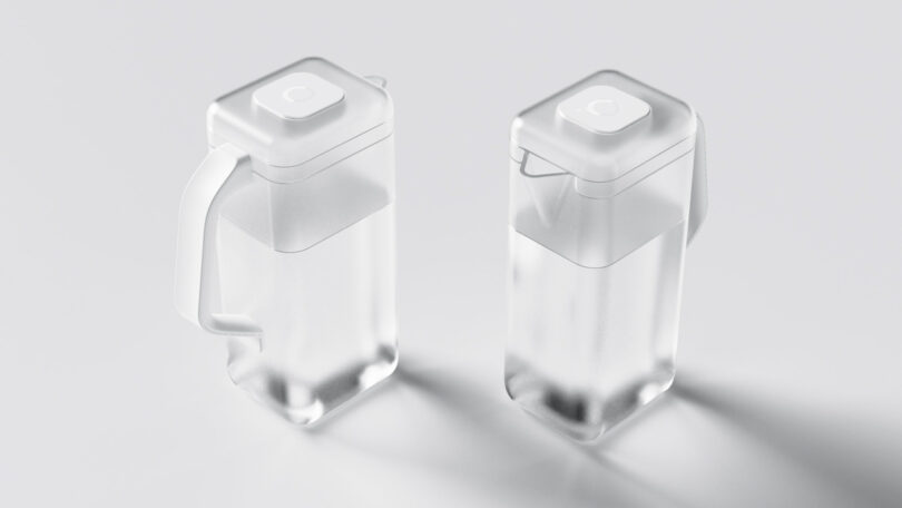 Two clear, square plastic containers with a lid, one has one handle and the other has a comfortable run. Both are filled with water and placed on a light surface.