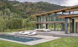 The house offers amenities in a resort style, including a pool that is surrounded by lying testers, two fireplaces and an entertainment area outdoors.