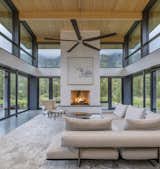 View from the kitchen island into the large room offers a 270-degree view of the surrounding landscape. "They are in the kitchen and can follow the Ridge line all around." says Bob. "They see how the light moves in this magical, harmonious way in the room."