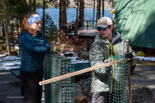 One person shows volunteers who can build a nest raft