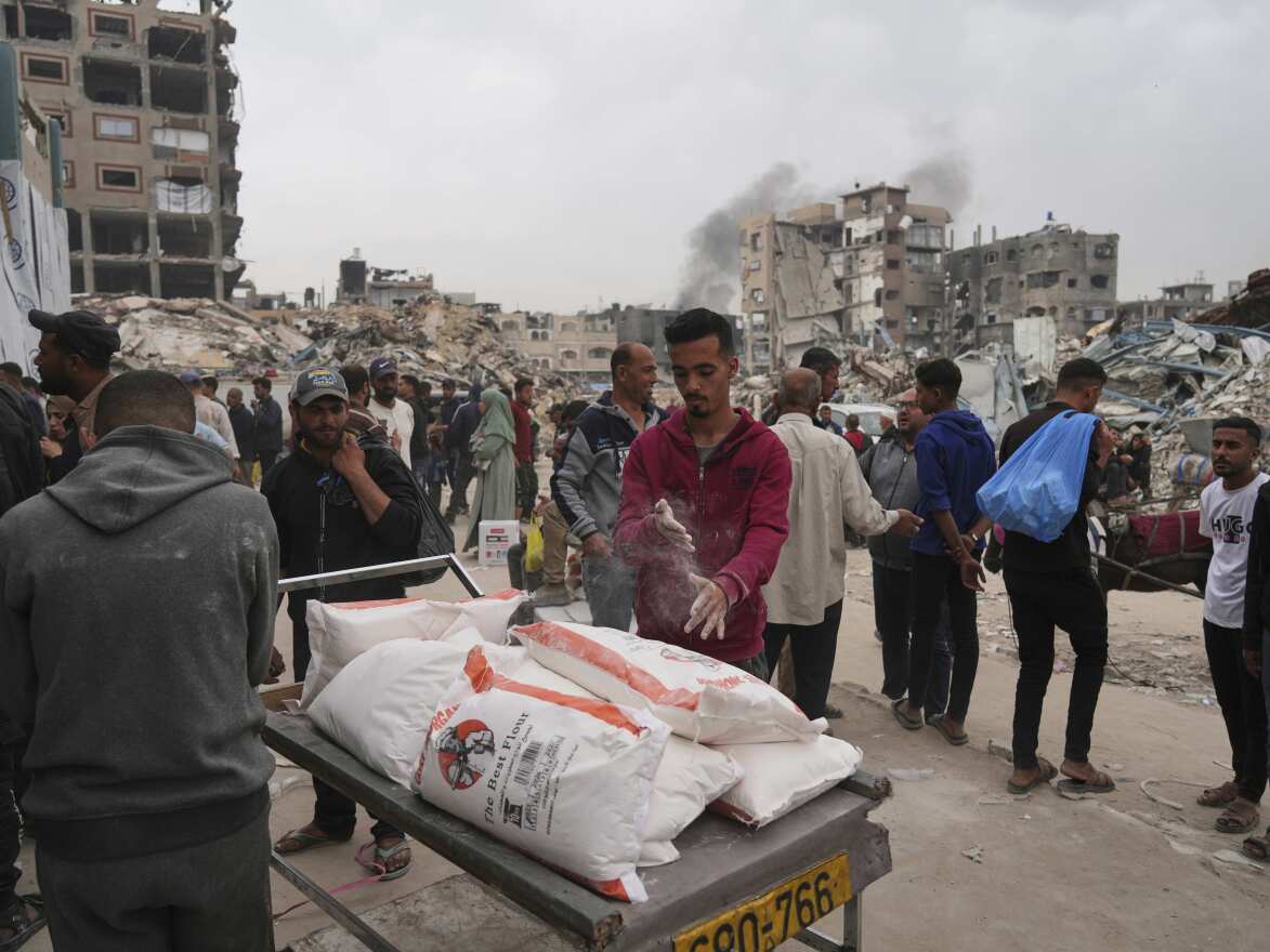 The Palestinians receive flour bags and other humanitarian aid, which are distributed by Unrwa, the UN agency, on Tuesday, April 1, 2025, in Jabaliya, the Gaza Strip, Palestinian refugees in Jabaliya, Gaza Strip.