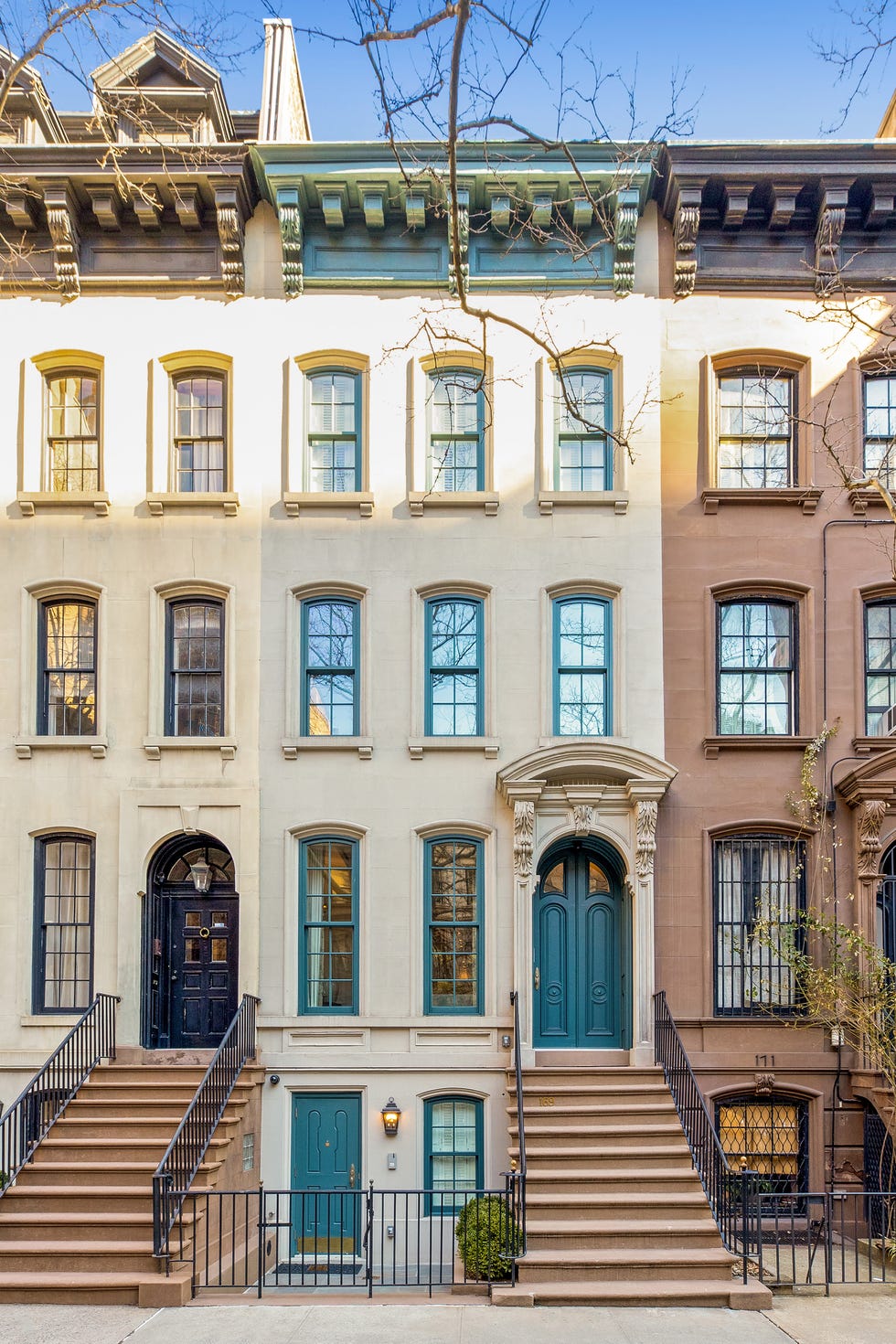 Series of historical town houses with different architectural details and colors.
