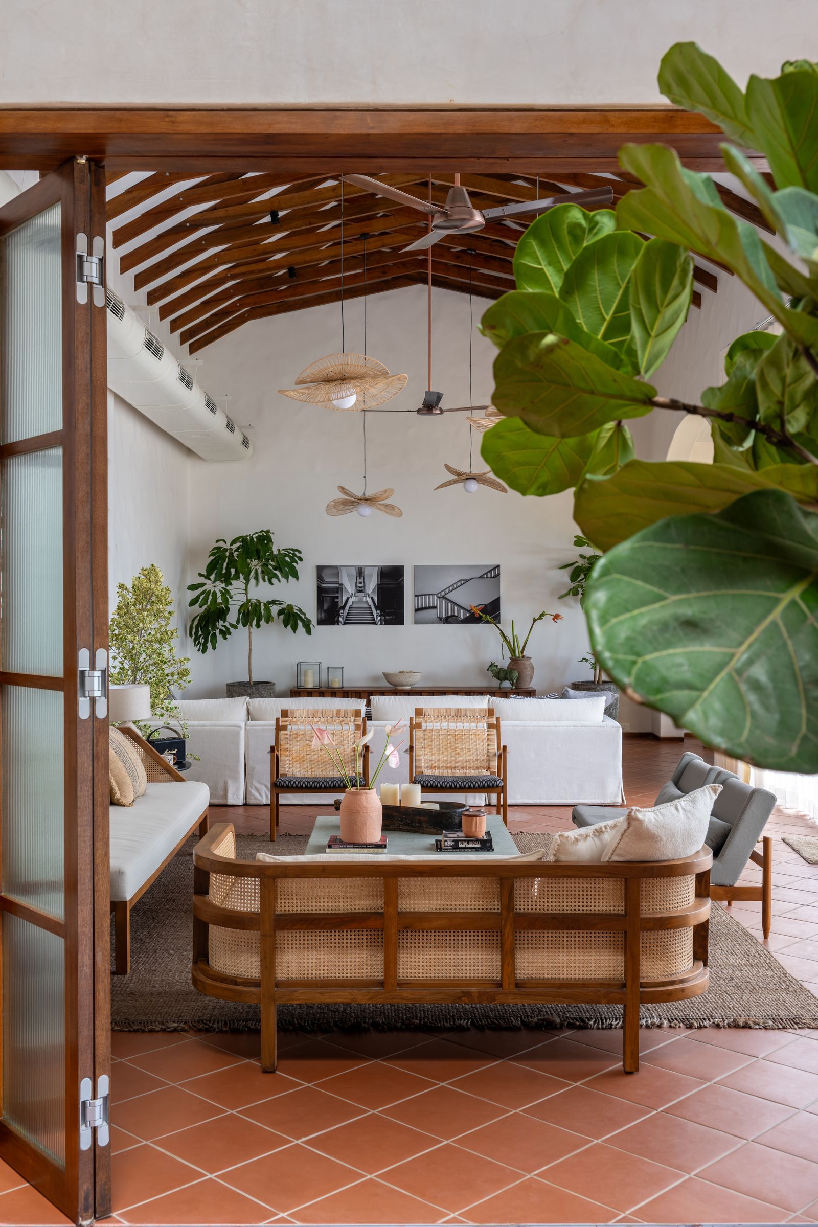 Image can contain plant chair furniture, coffee table table architecture building in the living room and space