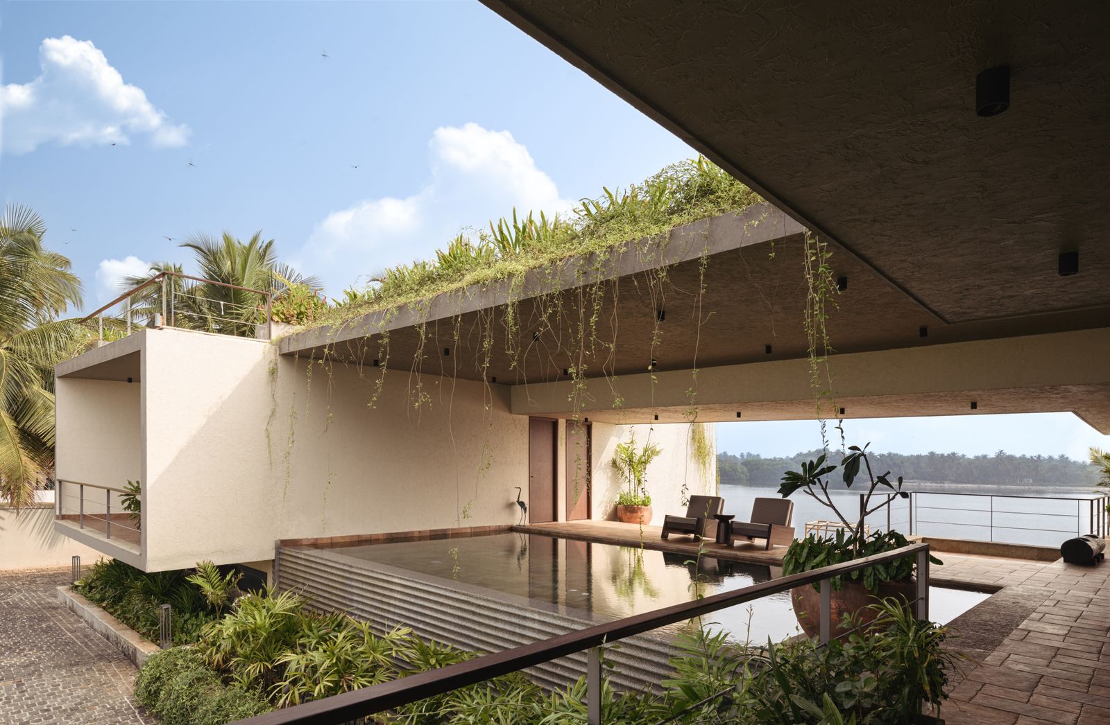 Image can contain nature outdoors outdoors The Haus Housing Villa Plant Chair and Furniture House