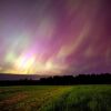 The Aurora Borealis, generally referred to as northern lights, illuminate the sky on May 10, 2024 via a horse pasture in Mercer, Maine.