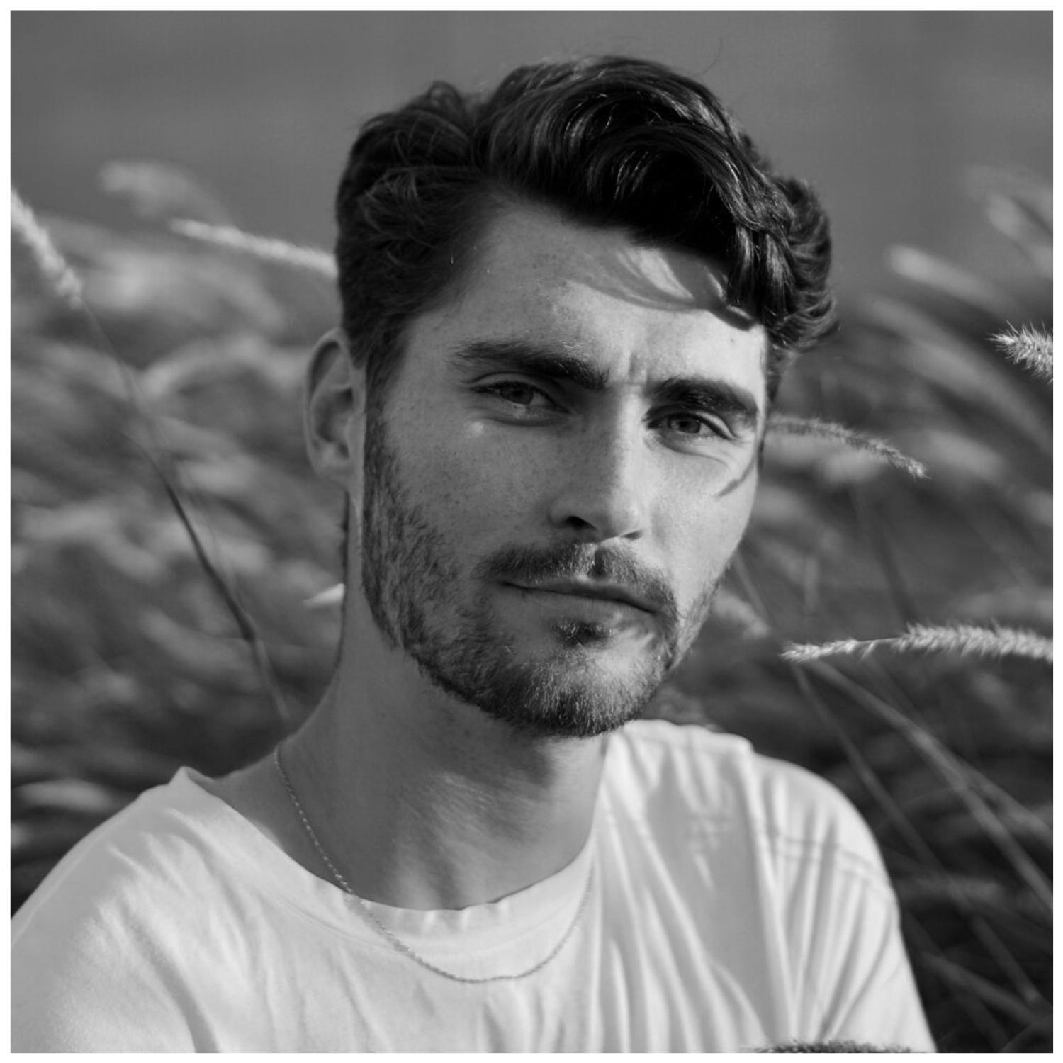 A head shot of the gardener Max Parker-Smith in black and white