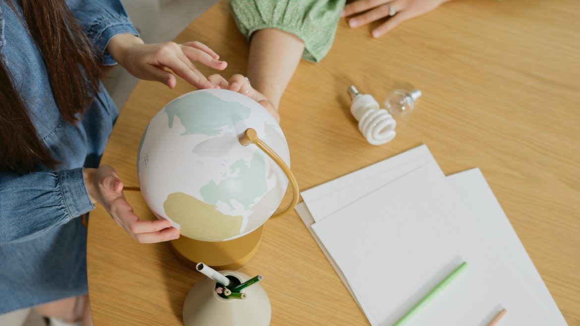 People who keep a globe with art needs on a desk