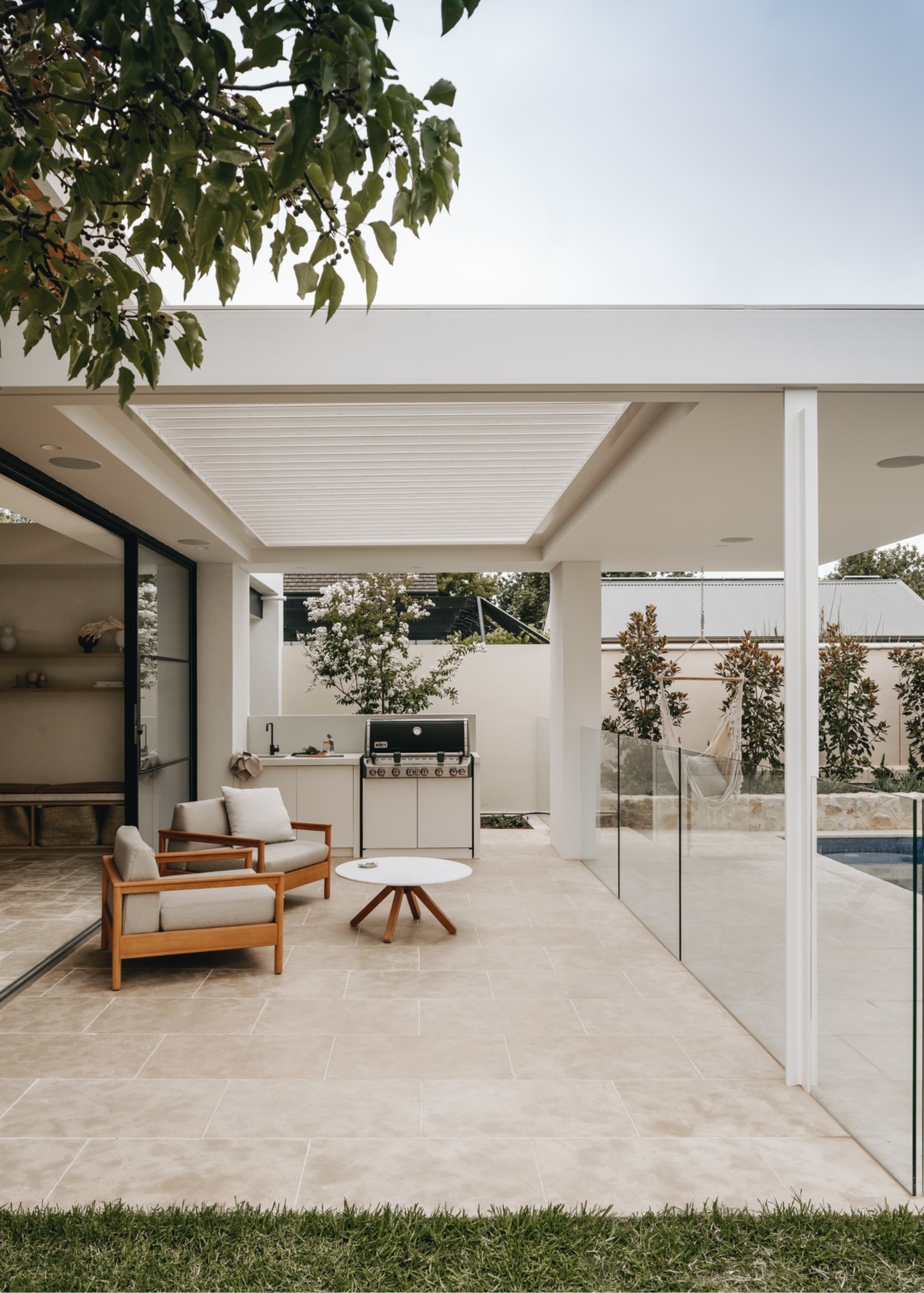 A back yard terrace with outdoor seating area