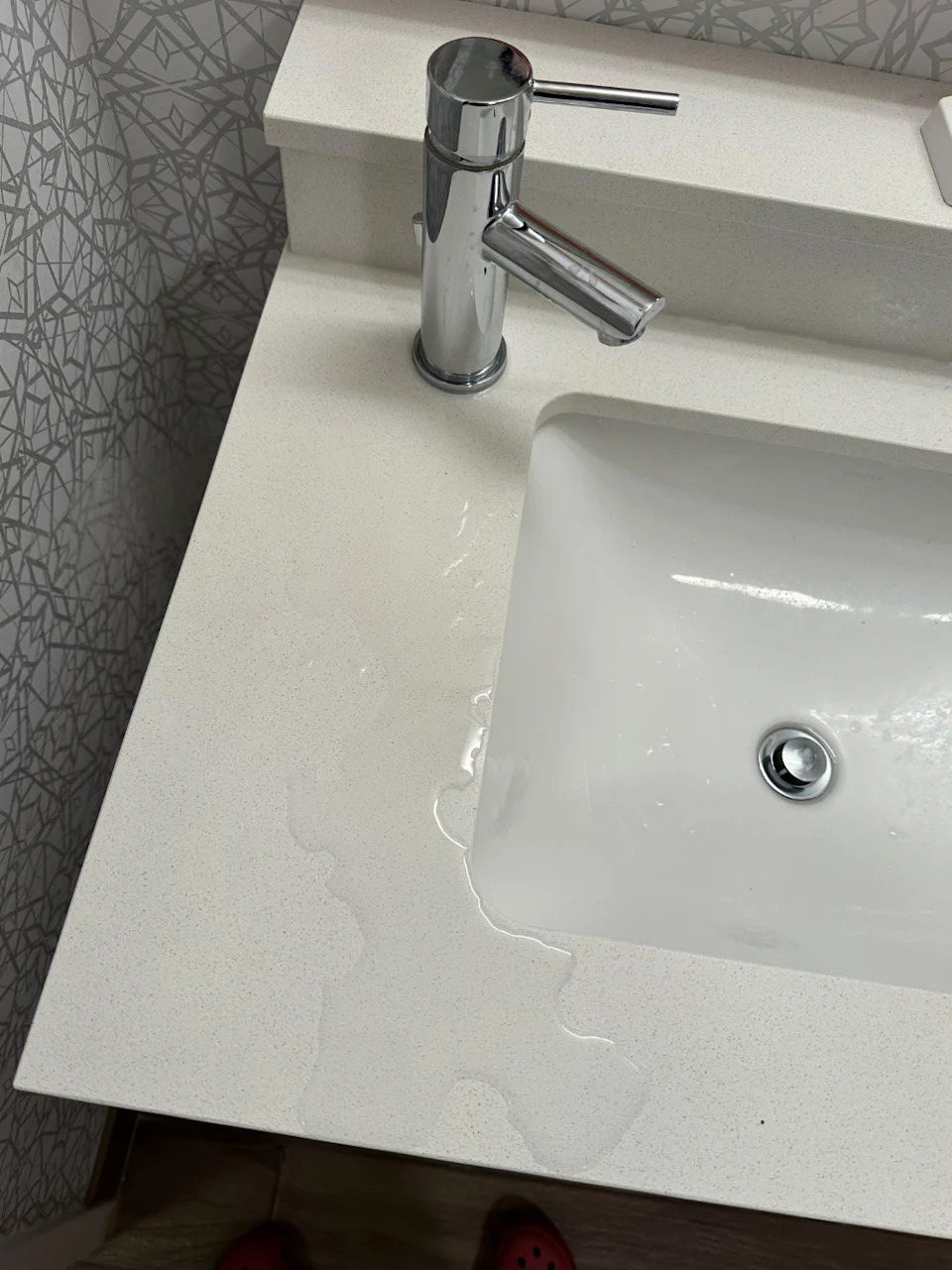 Water that flows out of a sink to a switch due to a running tap