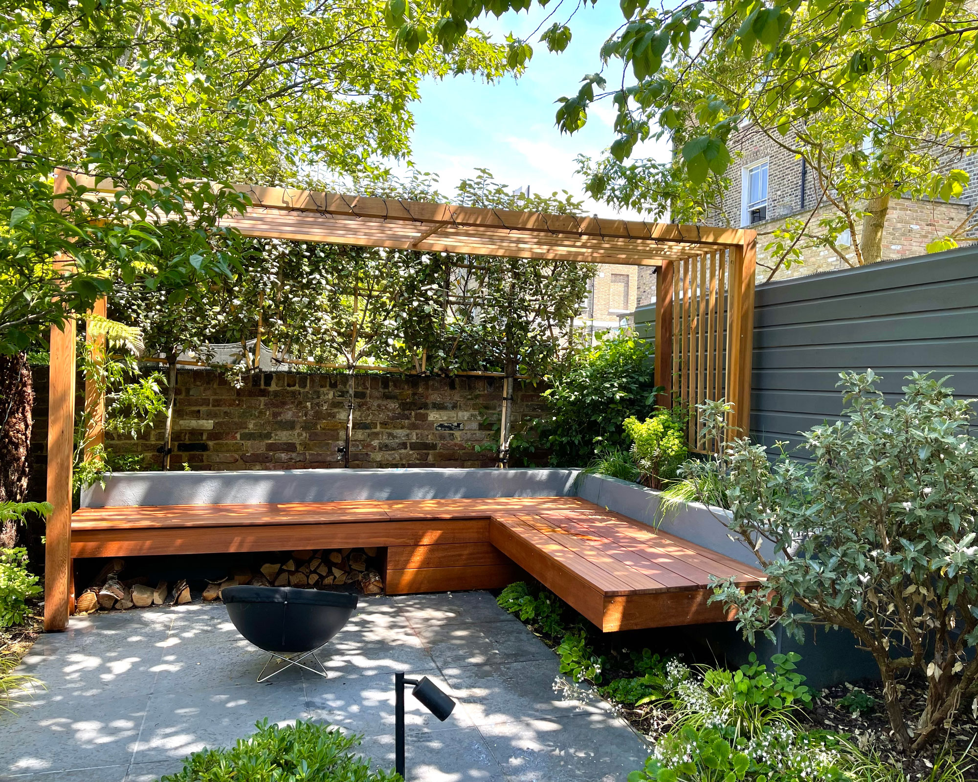 Modern pergola in the small urban garden