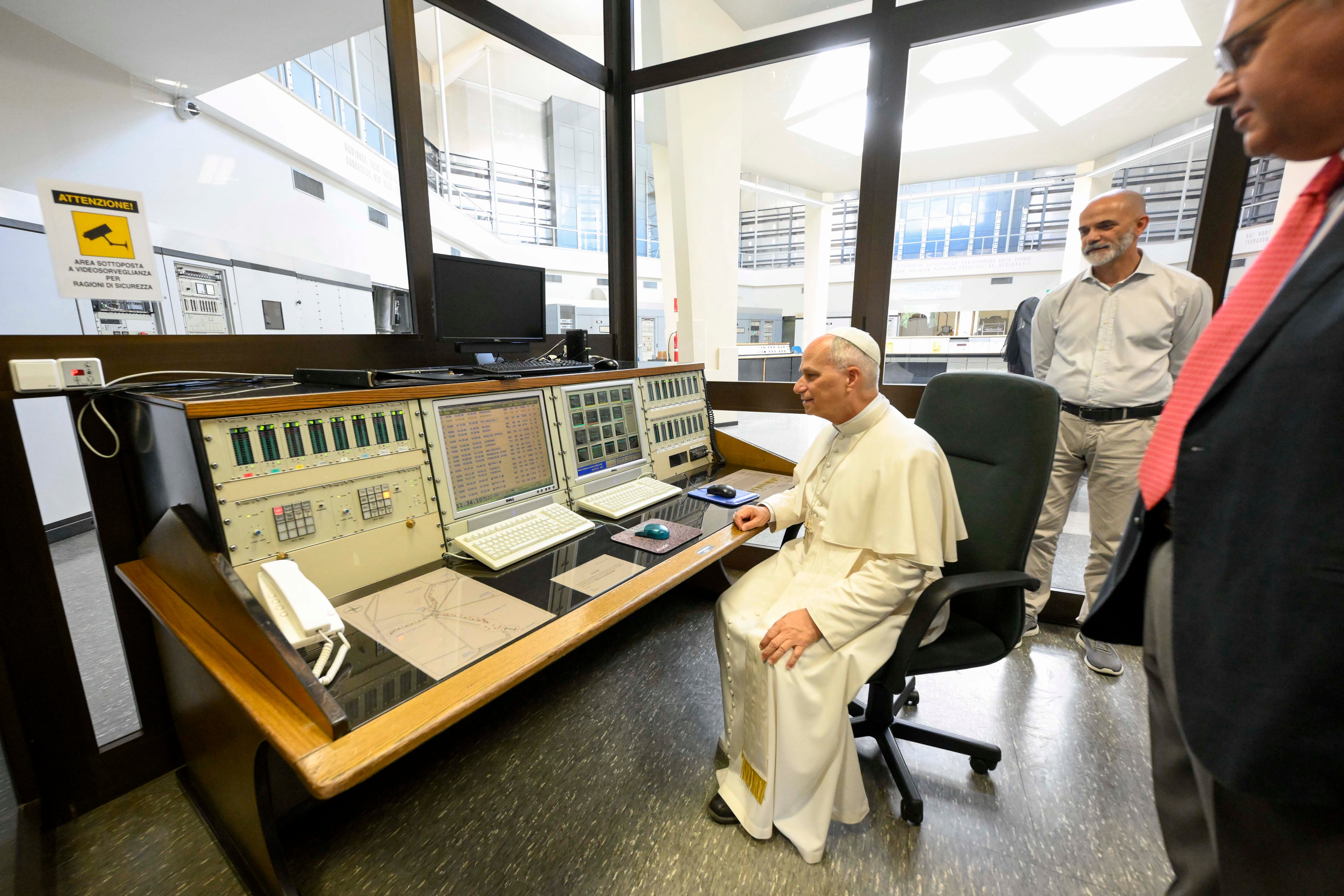 Pope Leo sits in a Vatican radio window
