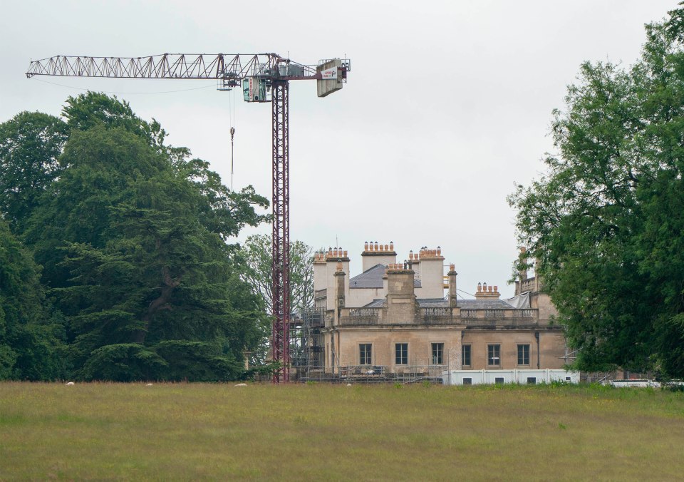 Construction crane near a manor house that is renovated.