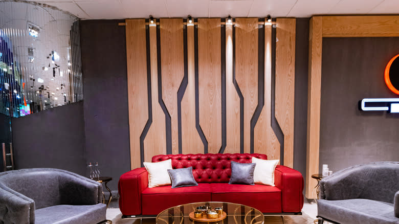 A versatile living room with wooden panels.