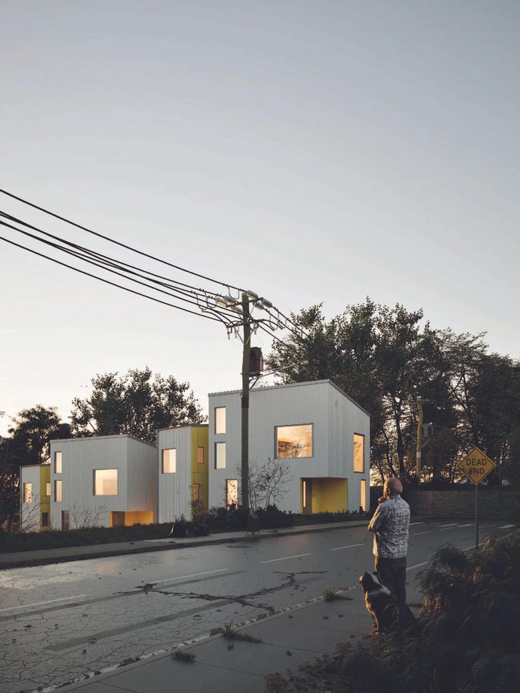 A model of a white and yellow house in a bleak road in Los Angeles
