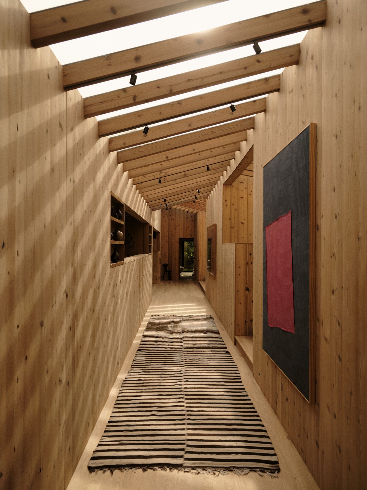 Image can contain interior design in interior designer wooden discs home decor carpet wooden architecture building and corridor