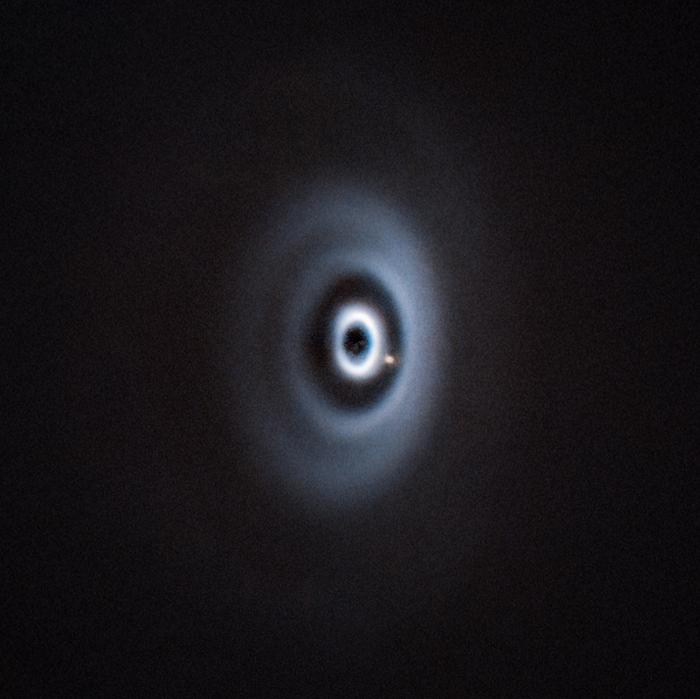 A cosmic newborn appears in a dust window and light