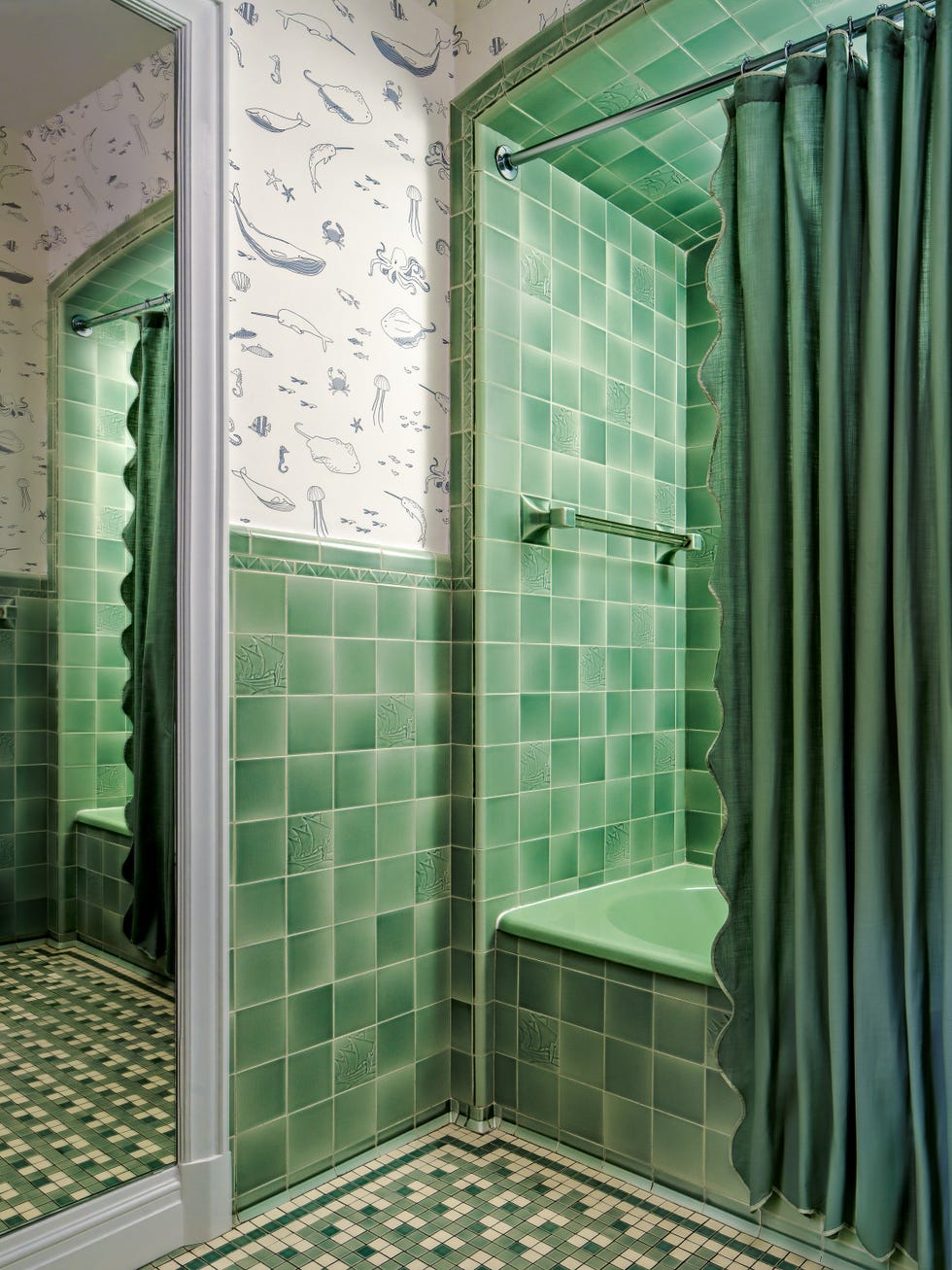 Bathroom with green tiles on walls and floor