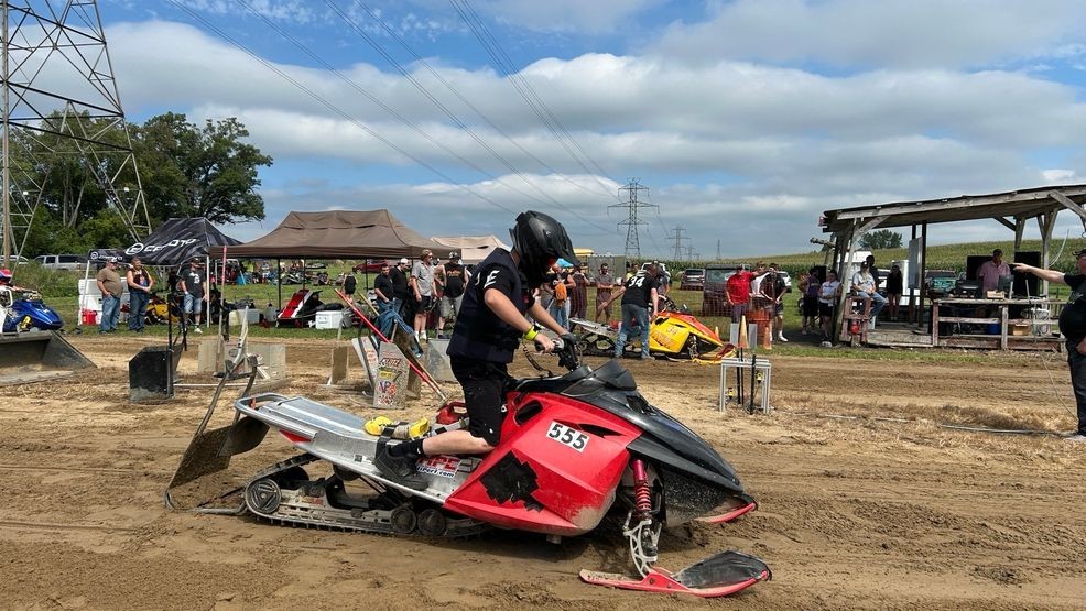 Nimby Pond attracts crowds on the annual snowmobile water crossing