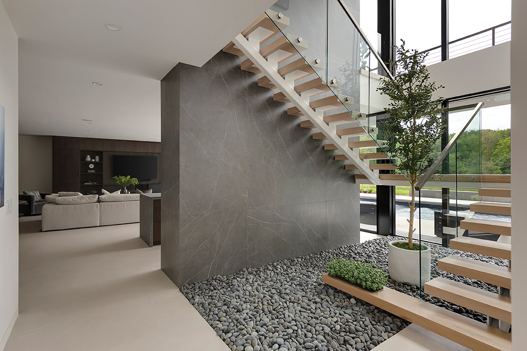 "Floating" Central staircase in Orono Home.