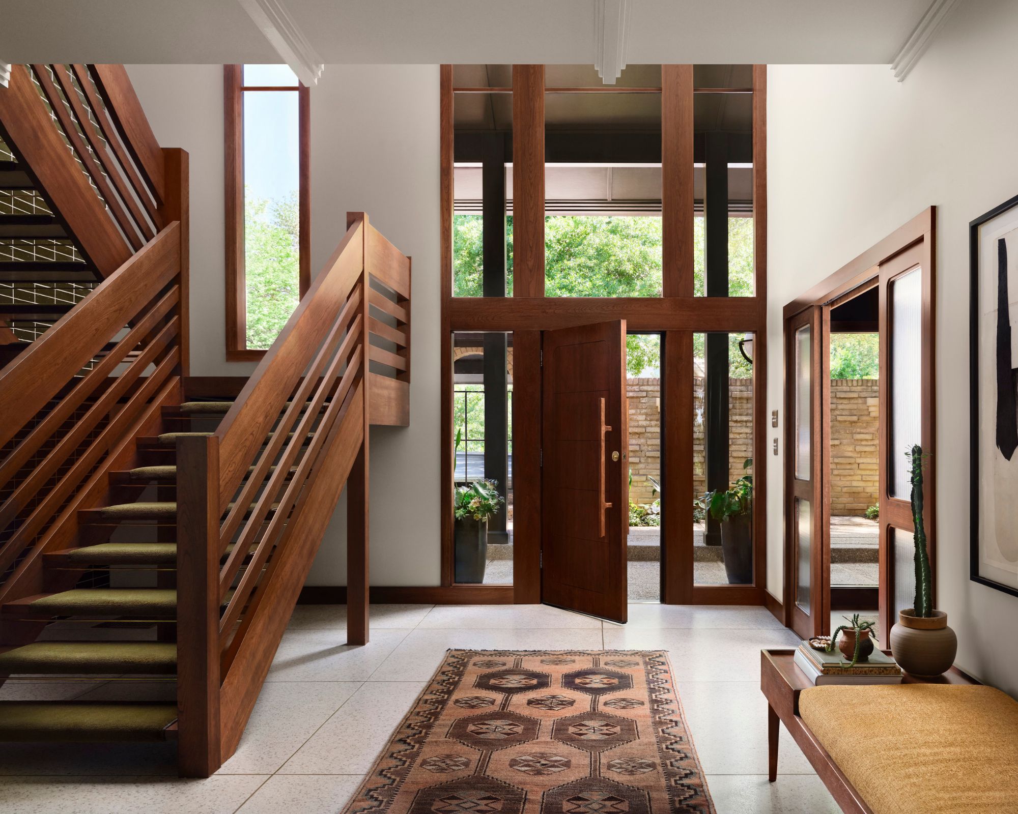 An entrance with high ceilings and a large wooden rocker