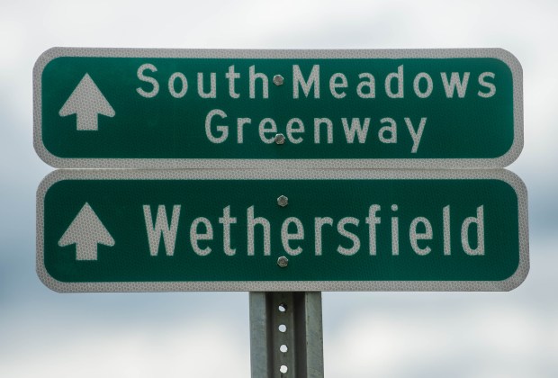 Signs along the Putnam Bridge Trail, which connects Wethersfield with Glastonbury via the Connecticut River on Friday, May 10, 2024. The trail is part of the South Meadow Greenway. (Aaron Flaum/Hartford Courant)