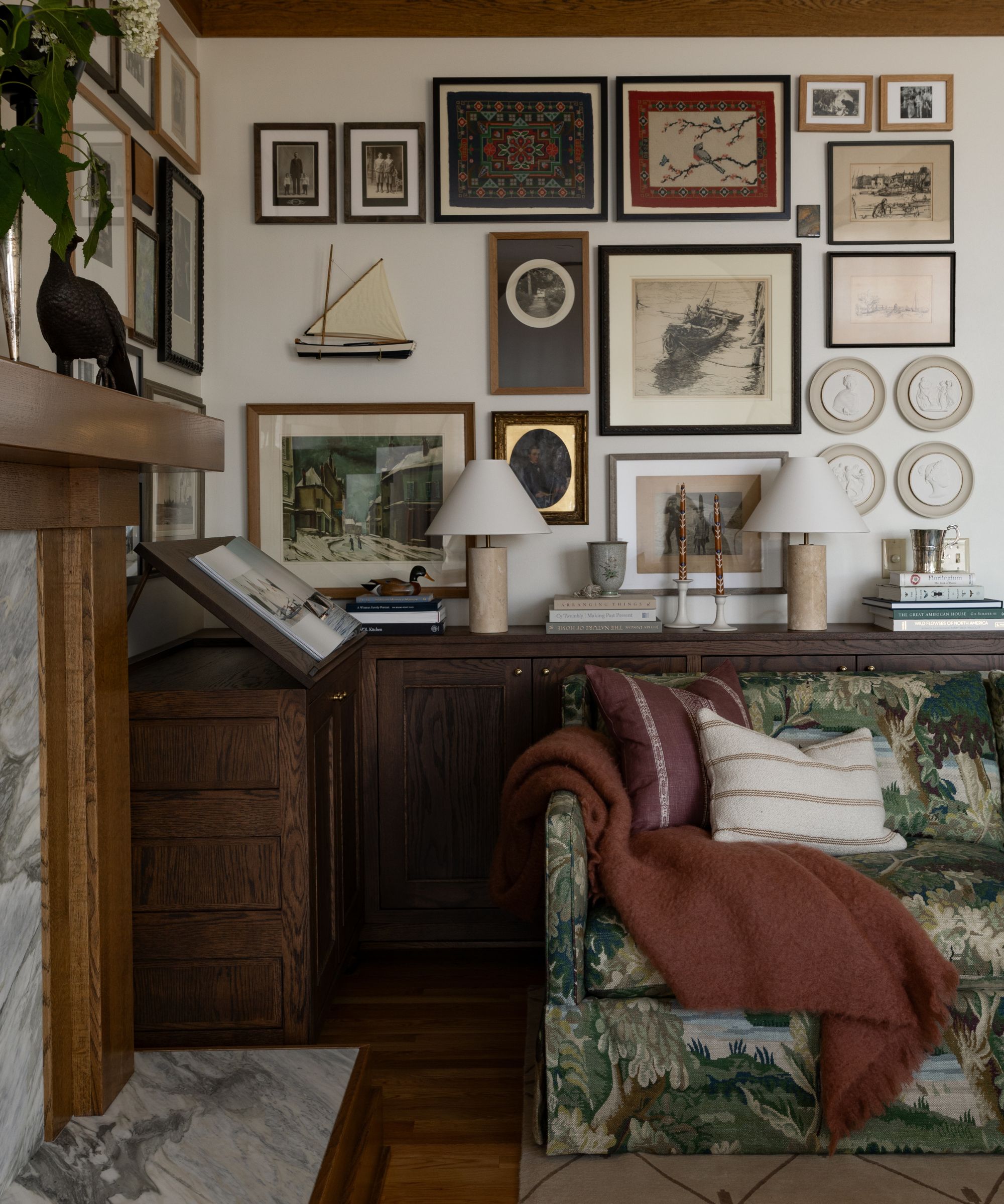 Craftsman-style living room with a patterned sofa and a vintage gallery wall