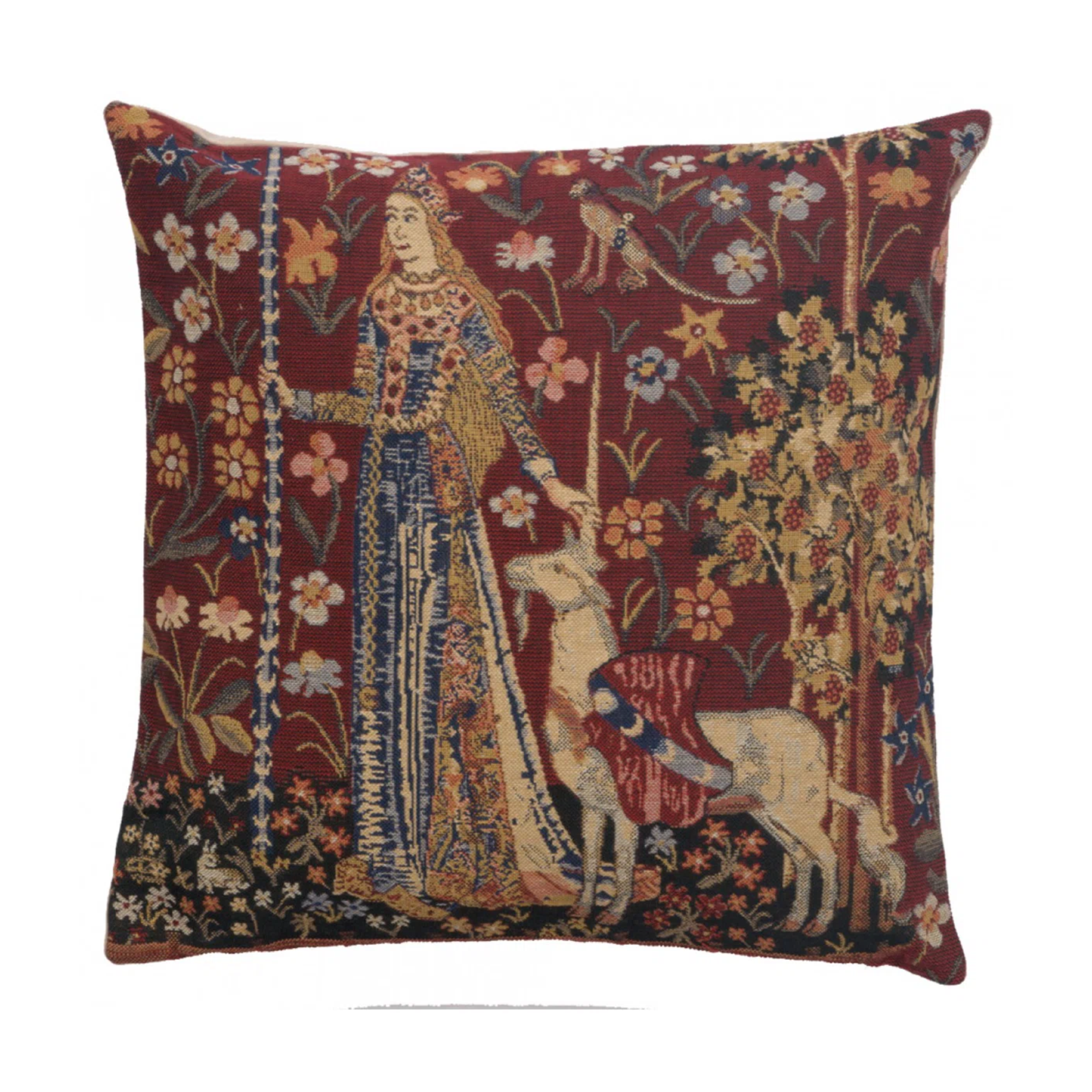 a vintage-inspired pillow featuring a woman in medieval clothing and a unicorn by her side