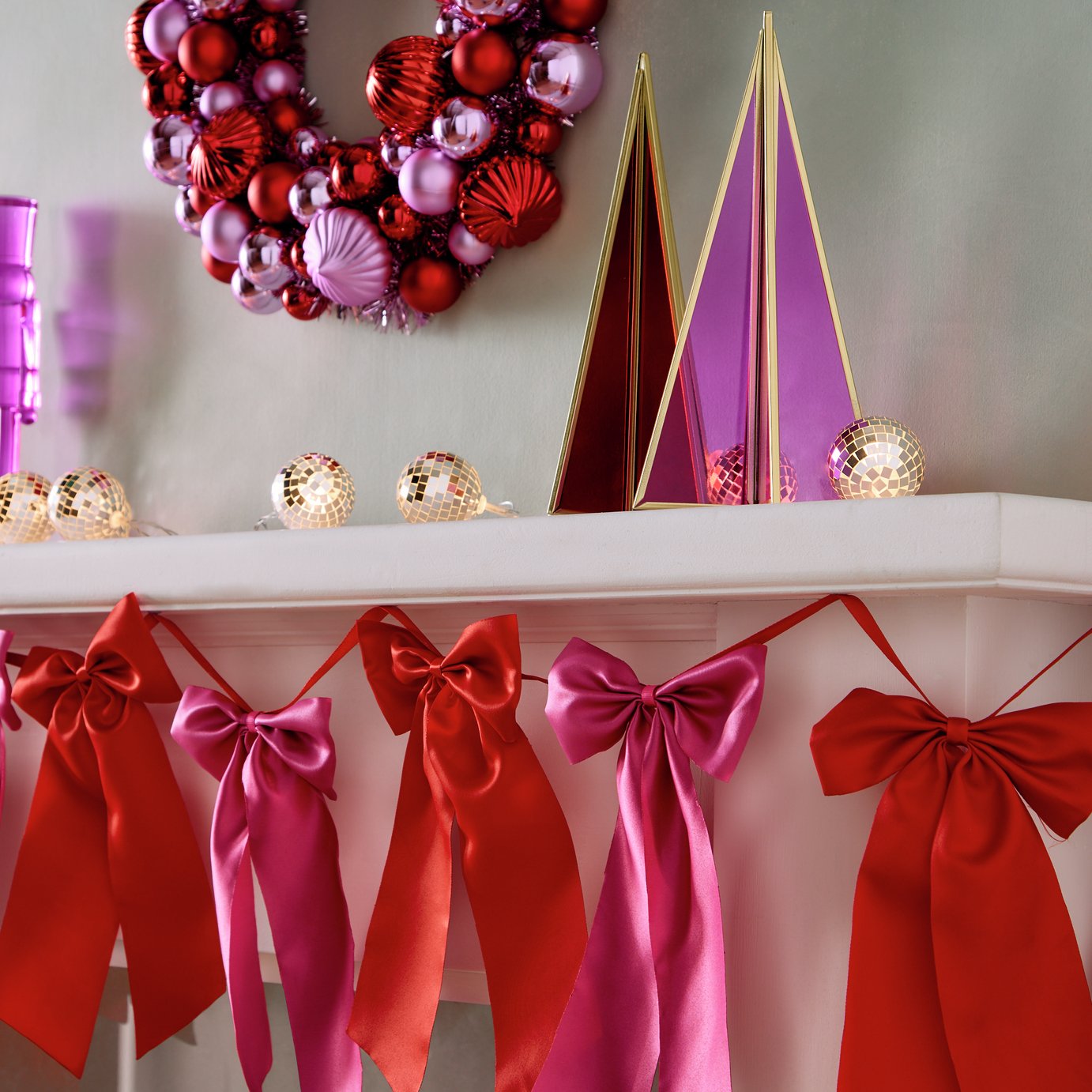 Habitat Christmas garland with red and pink satin bow
