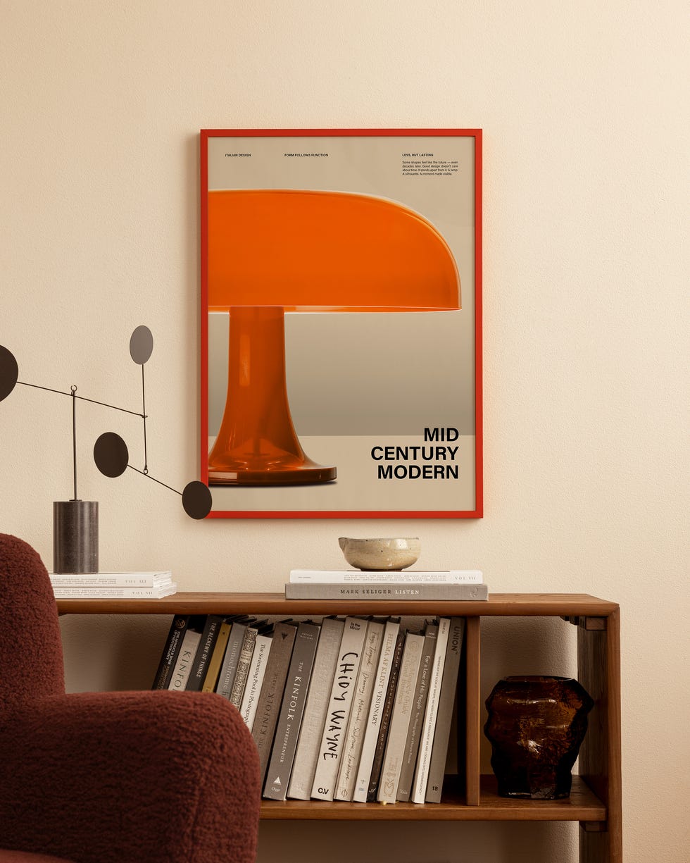 Mushroomcore art print The corner of a room with a mushroom art print, a wooden shelf and a brown bouclé chair