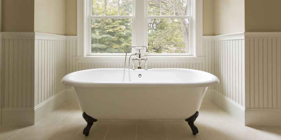 Claw-foot tub in custom bathroom.