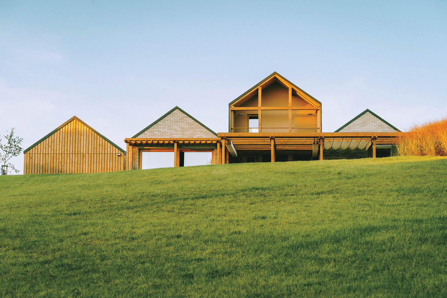 Exterior facade of a hut on a hill