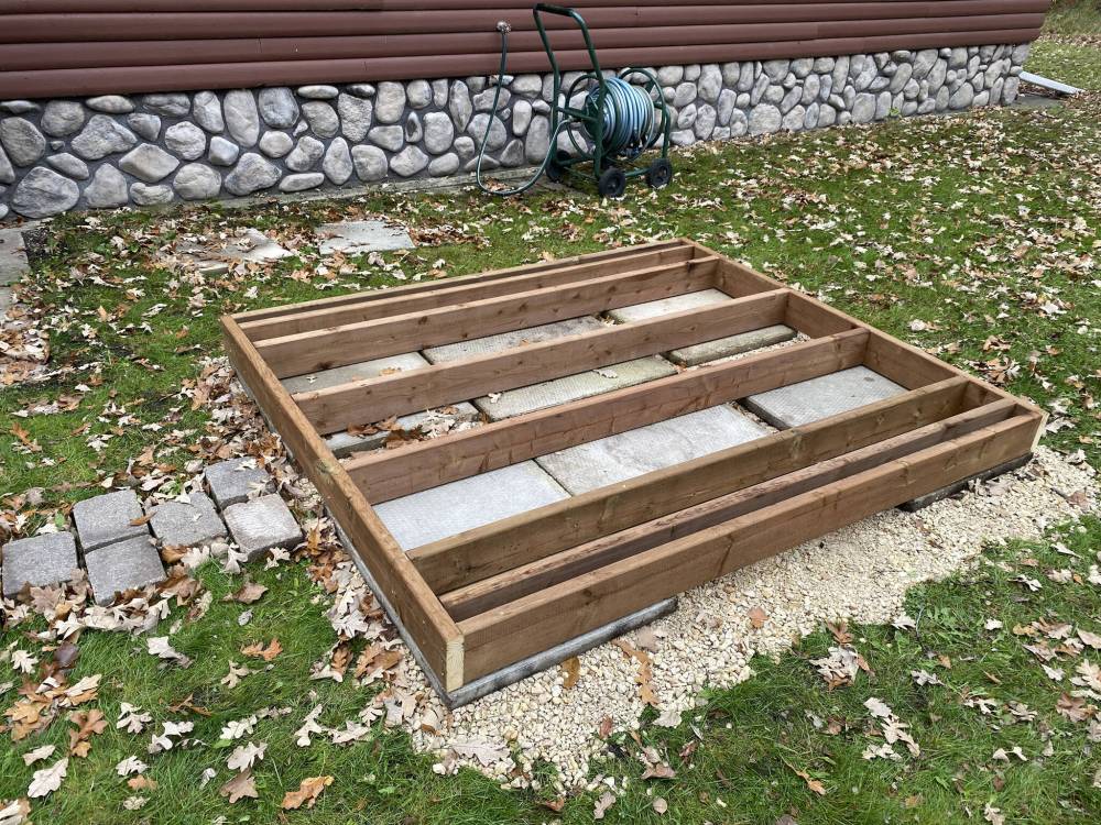 The two-by-six frame rests on 24-by-24-inch decking blocks to provide proper support for the 1,200-pound sauna. (Marc LaBossiere/Free Press)