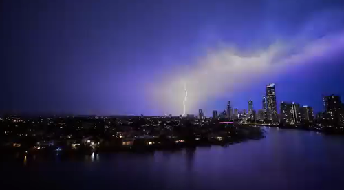 Storms in southeast Queensland are ripping off roofs, dropping huge hail and leaving 95,000 people without power
