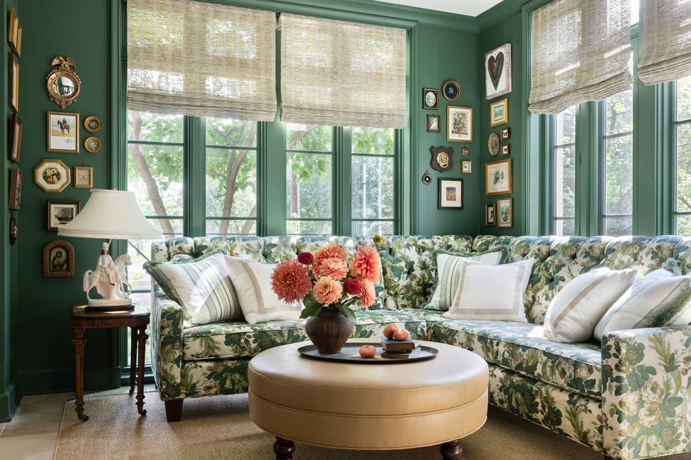 Room with green walls and floral sofa