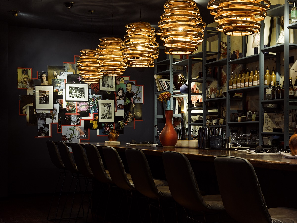 Low lighting and a photo gallery in the bar at 25 The Trip